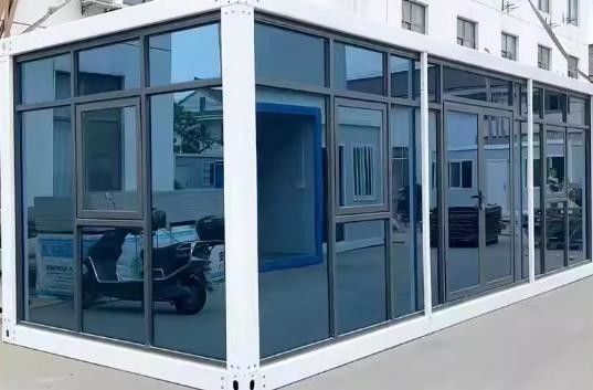 Contenedor de paquete plano Puerta de acero desmontable Oficina móvil Modular Pared de vidrio Hogar pequeño