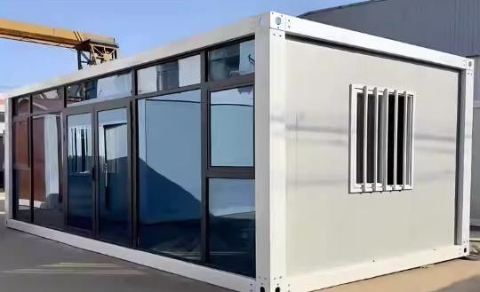 Contenedor de paquete plano Puerta de acero desmontable Oficina móvil Modular Pared de vidrio Hogar pequeño