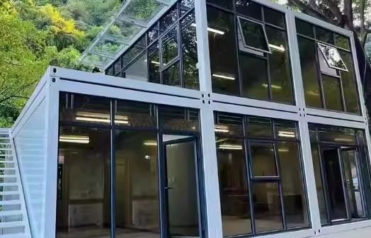 Contenedor de paquete plano Puerta de acero desmontable Oficina móvil Modular Pared de vidrio Hogar pequeño